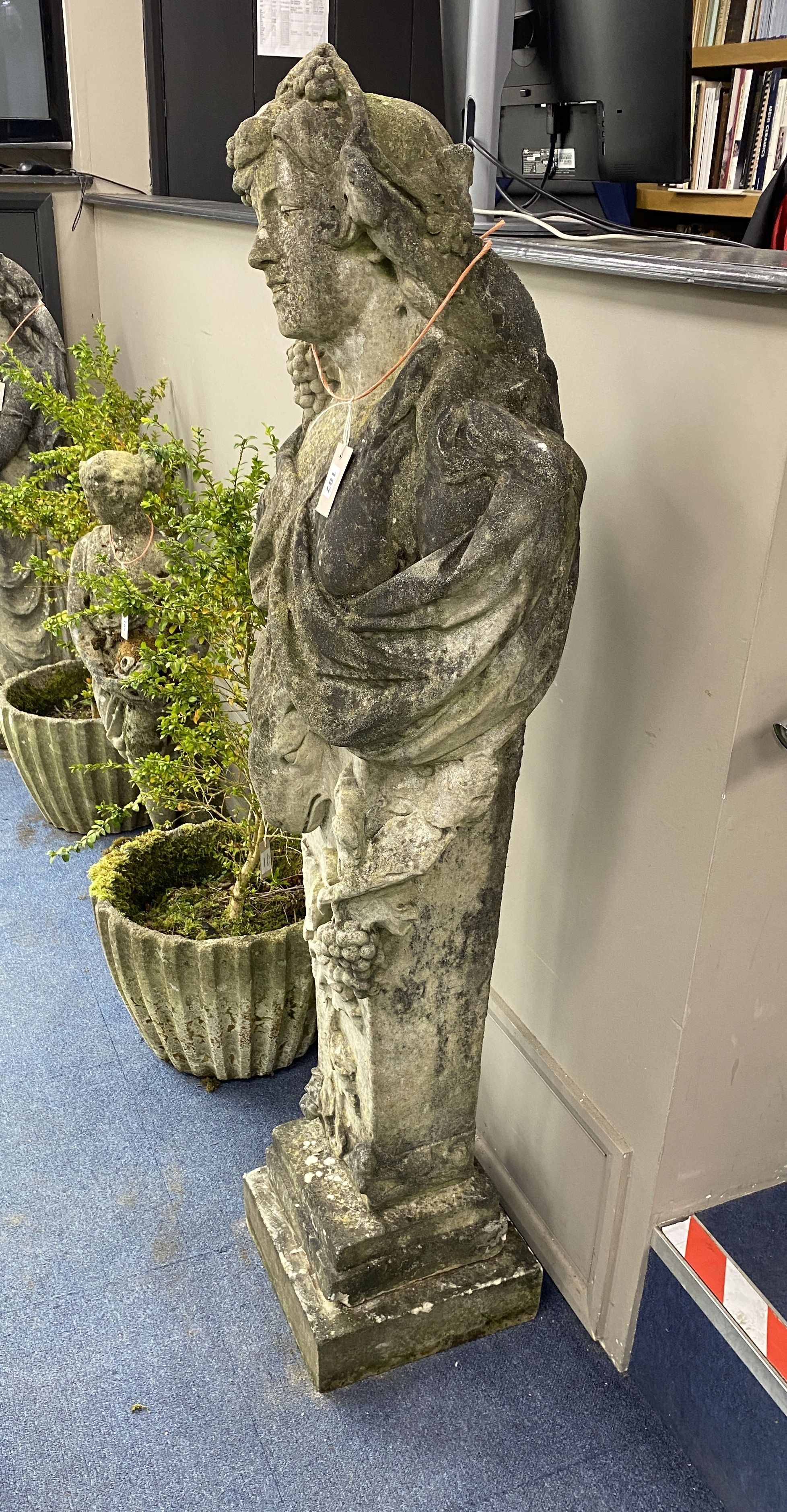 A reconstituted stone figure of a term, on a stepped square plinth, height 156cm